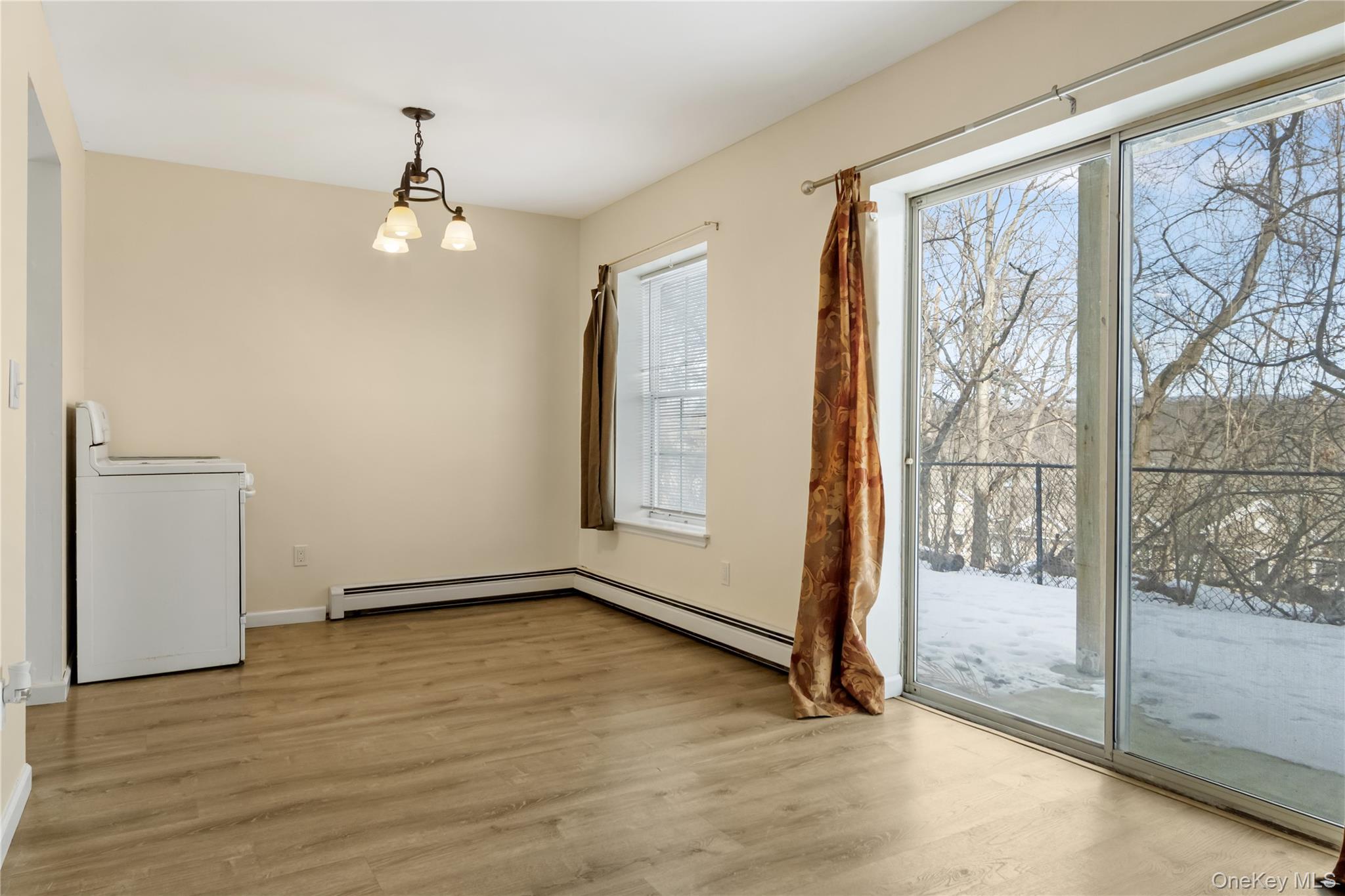 7 Lexington Hills Road, Unit 8 Harriman, NY 10926 - Photo 7 of 17 a view of an empty room with glass door