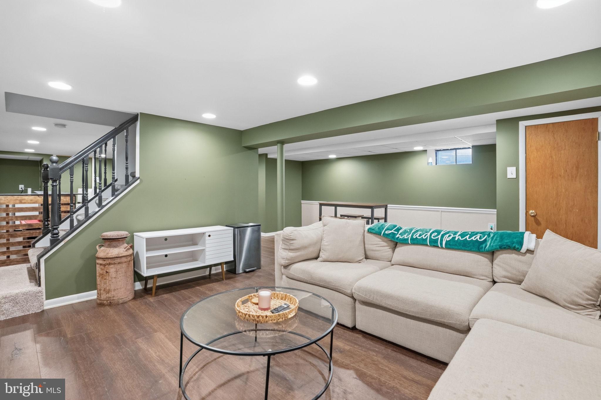 303 Radcliffe Road Glenside, PA 19038 - Photo 20 of 36 a living room with furniture and wooden floor