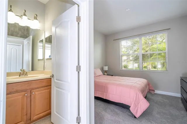 a living room with furniture and a dining table with wooden floor
