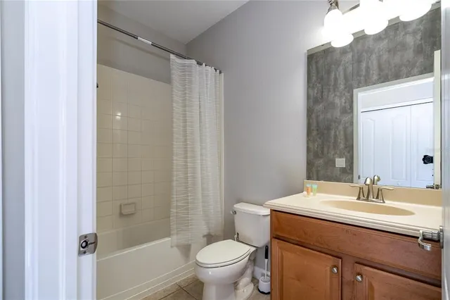 a large kitchen with stainless steel appliances lots of counter space and furniture