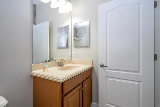 a kitchen with granite countertop cabinets stainless steel appliances and a counter space