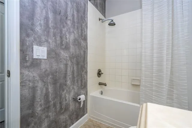 a kitchen with stainless steel appliances granite countertop a refrigerator and a stove