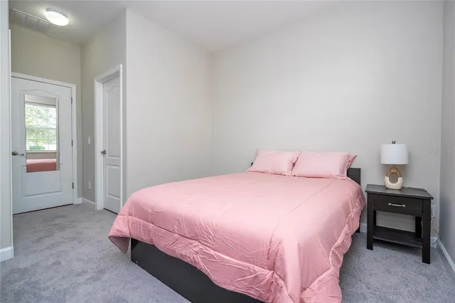 a kitchen with granite countertop stove top oven microwave and cabinets