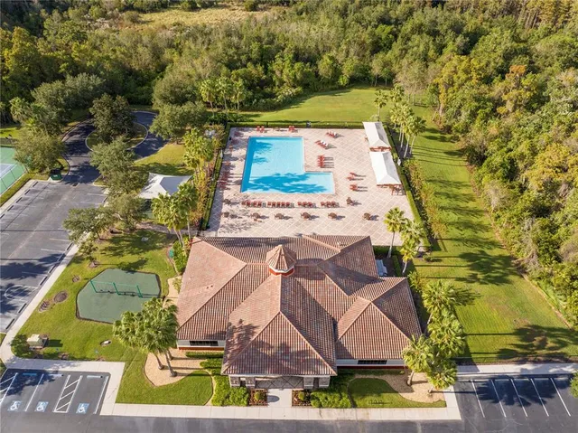 an aerial view of a house with a swimming pool