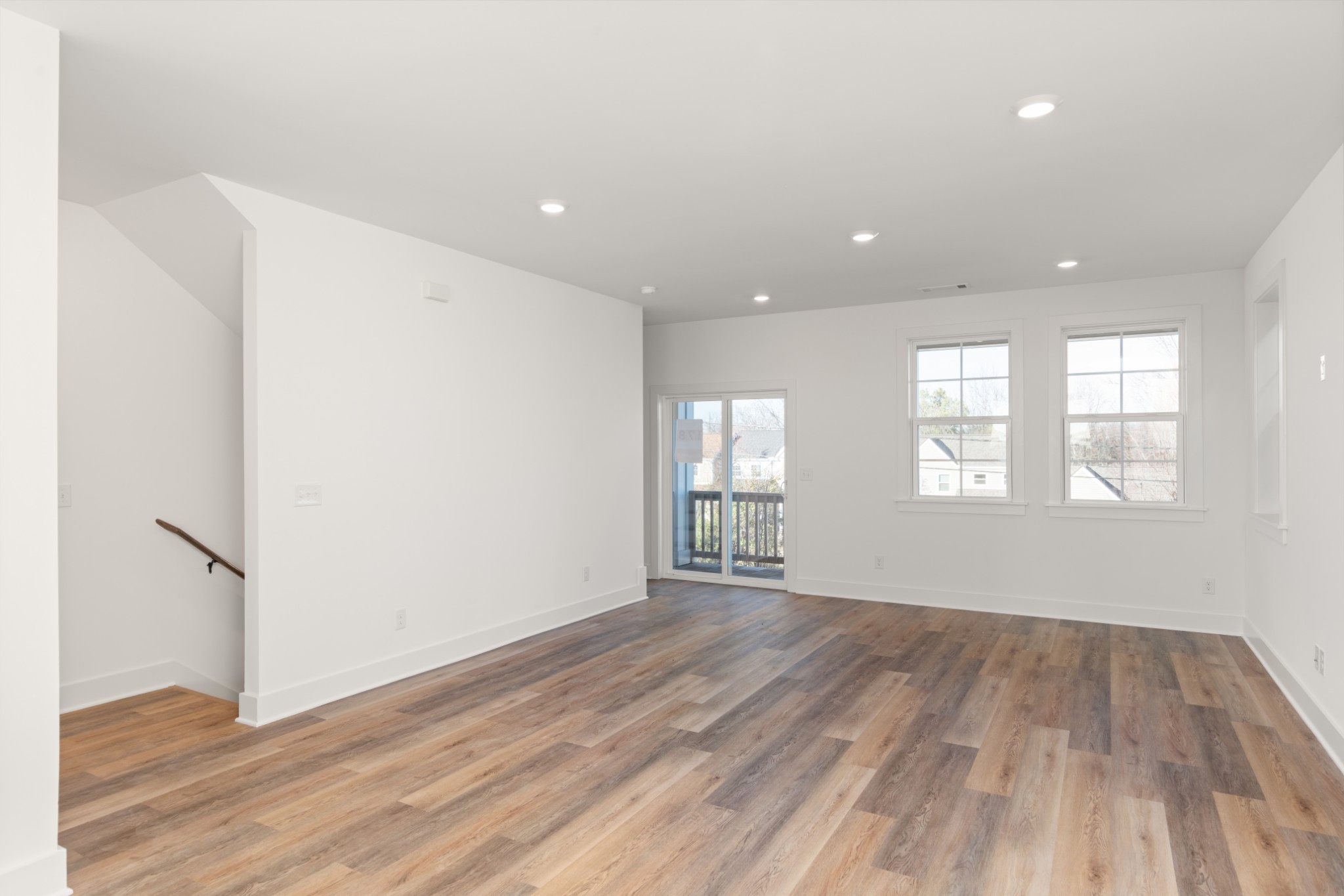 249 Nesbitt Lane Madison, TN 37115 - Photo 14 of 35 a view of an empty room with wooden floor and a window