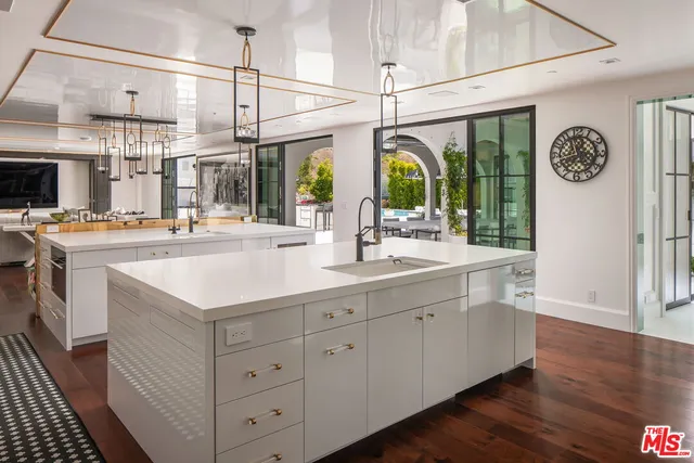 a kitchen with counter top space and window
