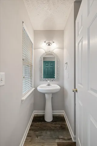 a bathroom with a sink and mirror