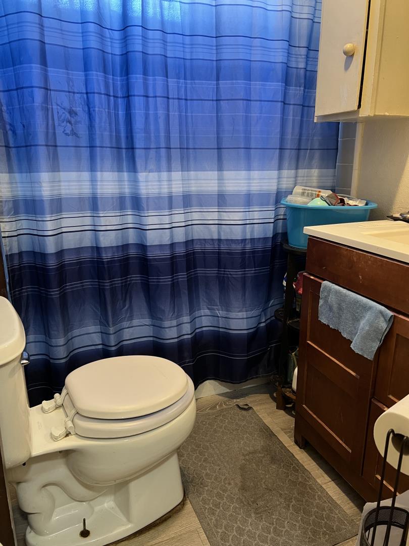 101 Smith Street Salinas, CA 93905 - Photo 26 of 26 a bathroom with a toilet a sink and a mirror