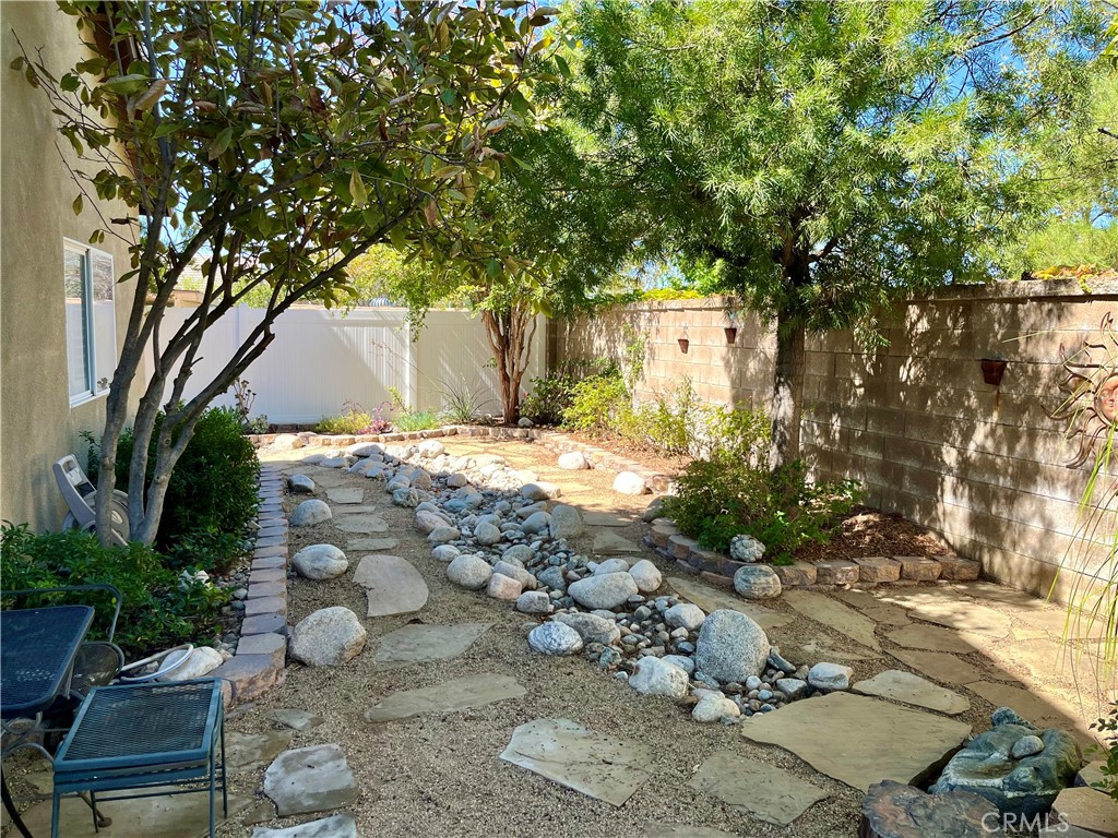 1244 Katherine Court Beaumont, CA 92223 - Photo 13 of 19 a backyard of a house with lots of green space
