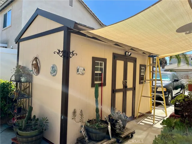 a view of a car parked in a yard