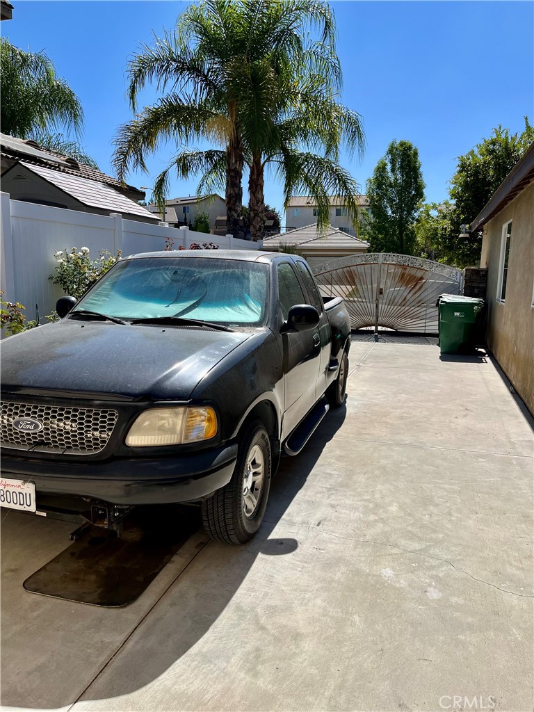 1244 Katherine Court Beaumont, CA 92223 - Photo 17 of 19 a view of a car parked in a yard