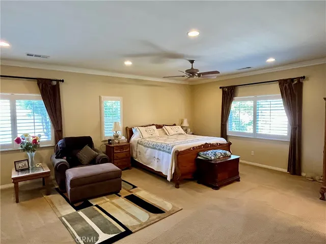 a bed room with furniture and window