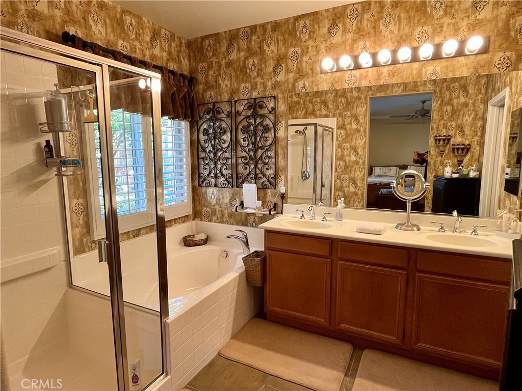 1244 Katherine Court Beaumont, CA 92223 - Photo 10 of 19 a bathroom with a tub sink and mirror