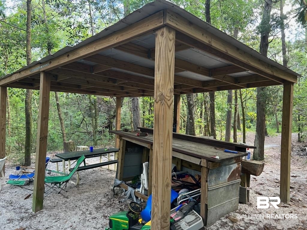 25400 Goat Cooper Road Robertsdale, AL 36567 - Photo 25 of 34 Covered area with bar at
