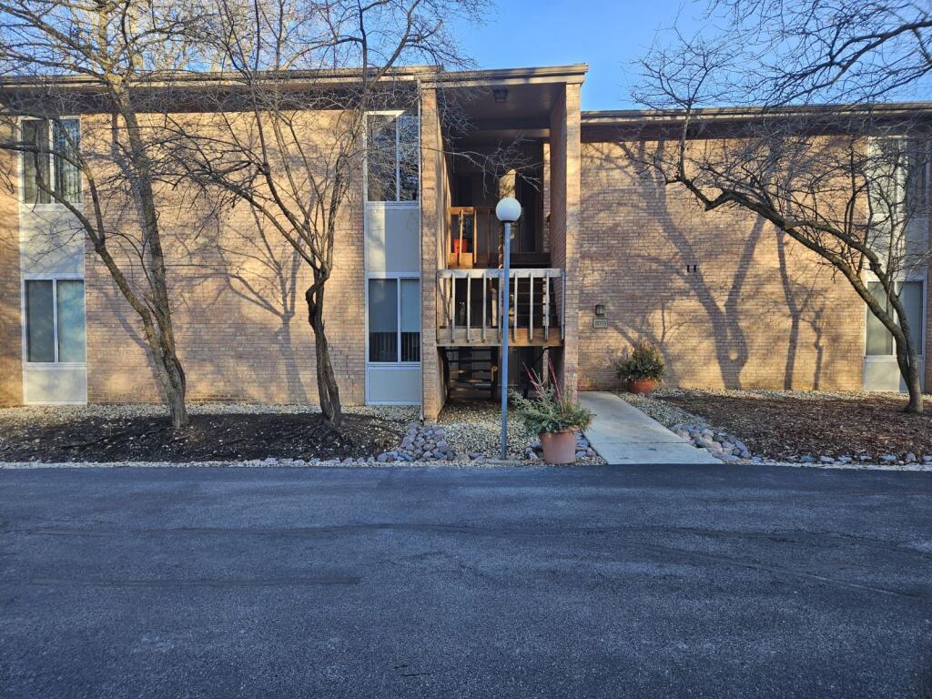 6009 Forest View Road, Unit 1B Lisle, IL 60532 - Photo 1 of 1 front view of a house with a yard