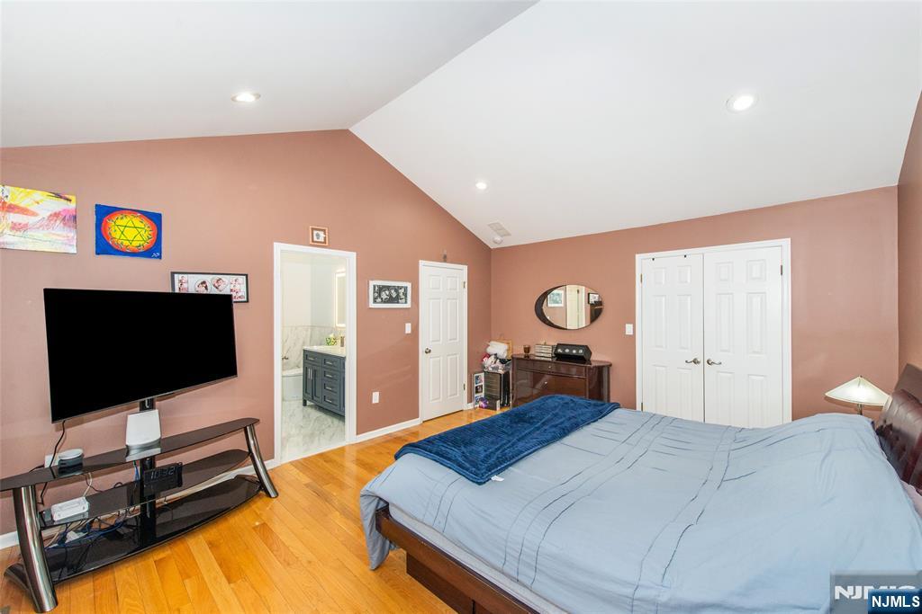 10 Gannet Court Wayne, NJ 07470 - Photo 14 of 24 a bedroom with a bed and a flat screen tv