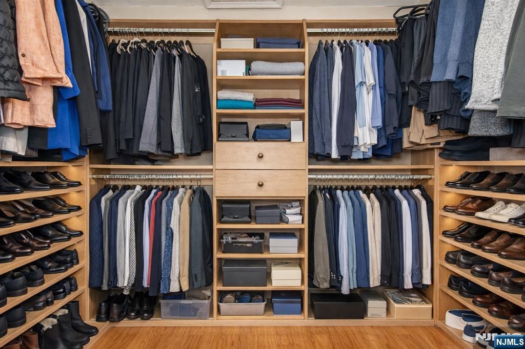 10 Gannet Court Wayne, NJ 07470 - Photo 17 of 24 a view of walk in closet with clothes and shoes