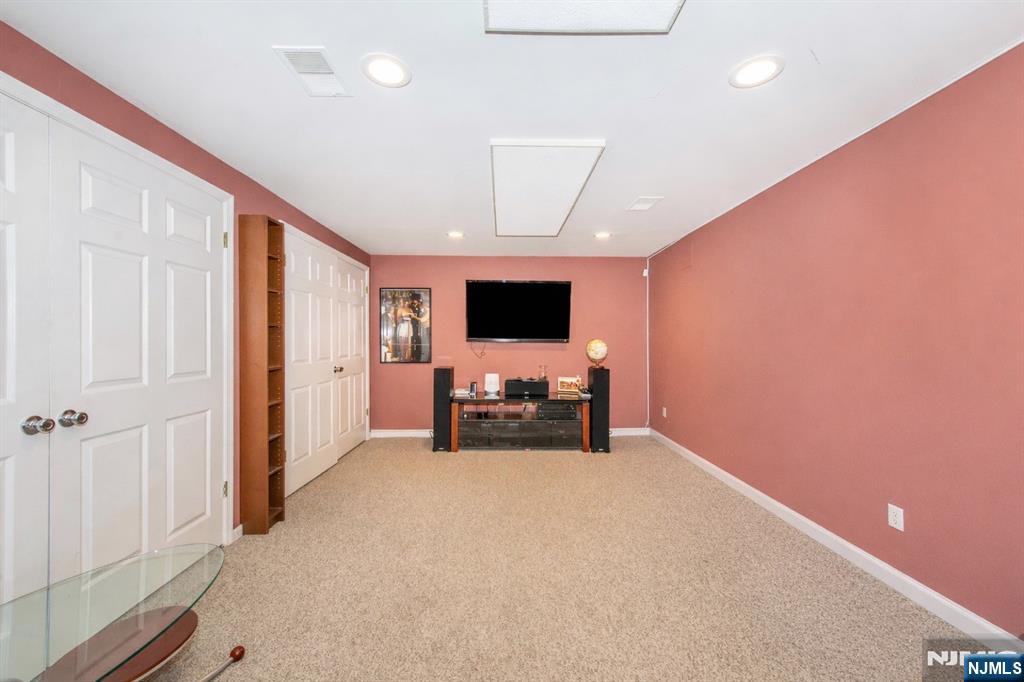 10 Gannet Court Wayne, NJ 07470 - Photo 21 of 24 a view of a livingroom with a flat screen tv