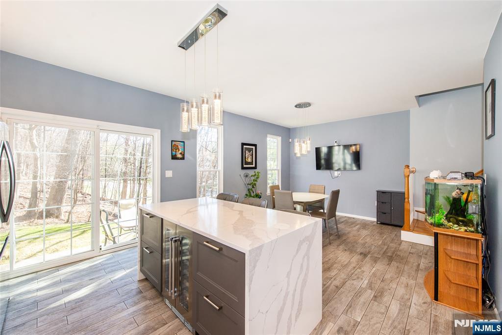 10 Gannet Court Wayne, NJ 07470 - Photo 3 of 24 a living room with stainless steel appliances granite countertop furniture and a wooden floor