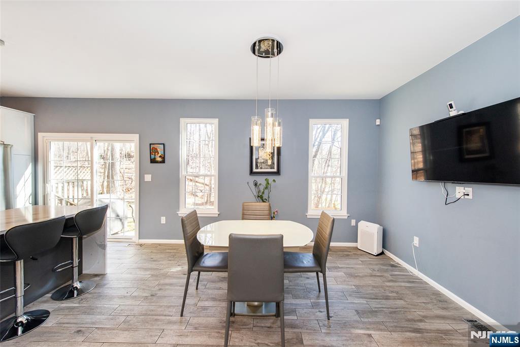 10 Gannet Court Wayne, NJ 07470 - Photo 6 of 24 a view of a dining room with furniture window and wooden floor