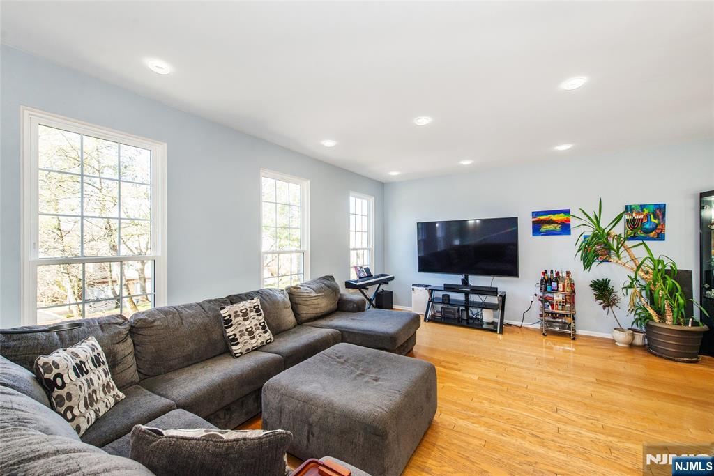 10 Gannet Court Wayne, NJ 07470 - Photo 8 of 24 a living room with furniture and a flat screen tv