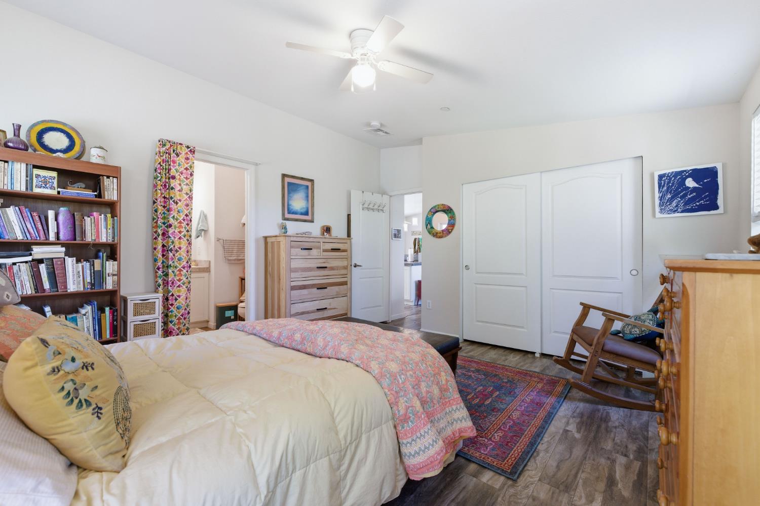 5015 Shooting Star Road Pollock Pines, CA 95726 - Photo 14 of 44 a bedroom with a bed and a book shelf