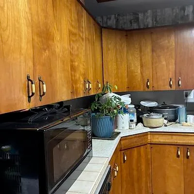 a kitchen with a sink and a stove top oven