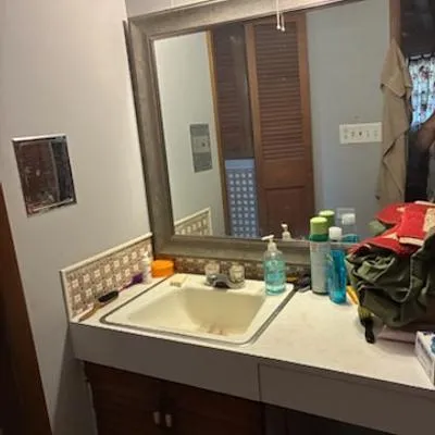 a bathroom with a sink and a mirror