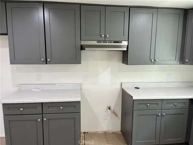 a view of cabinets and wooden floor