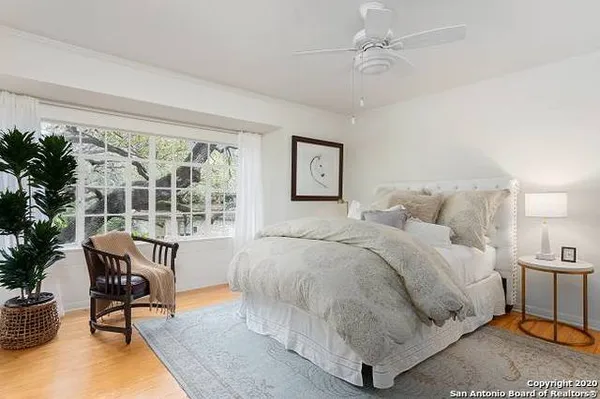 a bed room with a bed and a chair