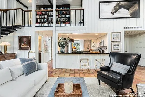a living room with furniture and a rug