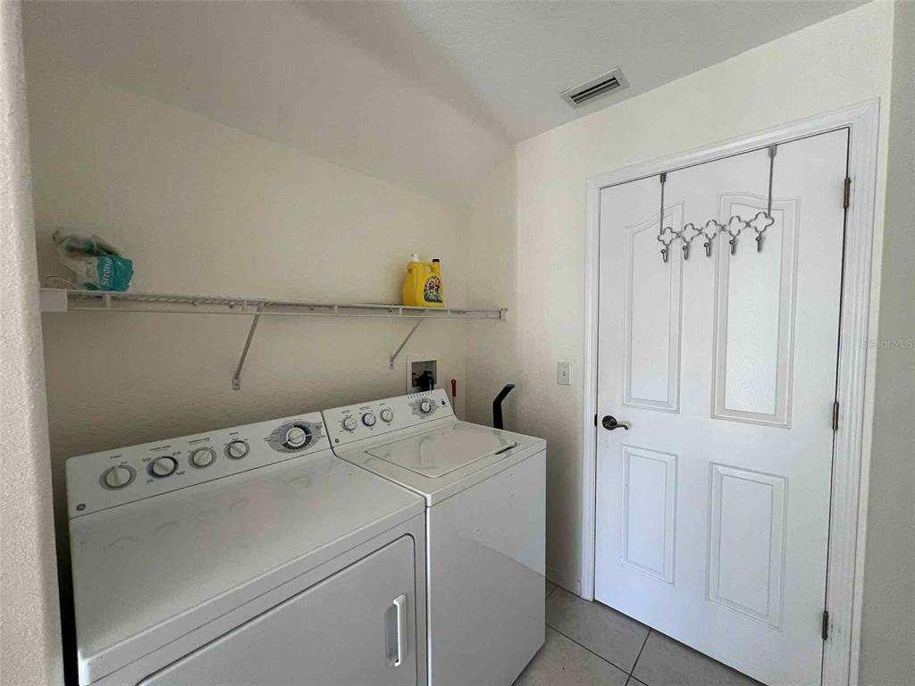 Undisclosed Address Spring Hill, FL 34608 - Photo 4 of 10 a utility room with dryer and washer