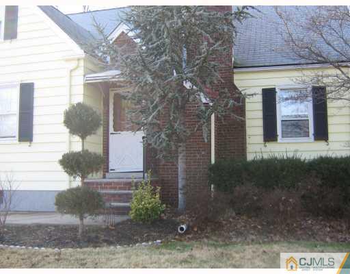 399 Plainfield Road Edison, NJ 08820 - Photo 1 of 8 a front view of a house with garden