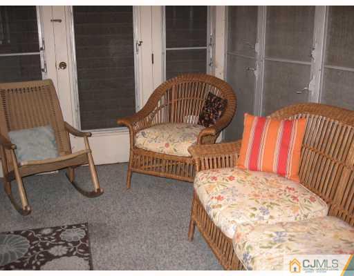 399 Plainfield Road Edison, NJ 08820 - Photo 5 of 8 a bedroom with furniture and a wooden floor