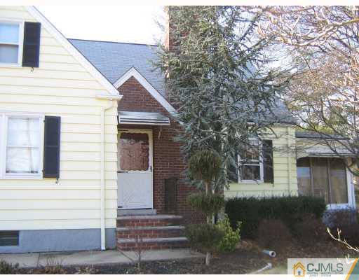 399 Plainfield Road Edison, NJ 08820 - Photo 8 of 8 a front view of a house with a yard