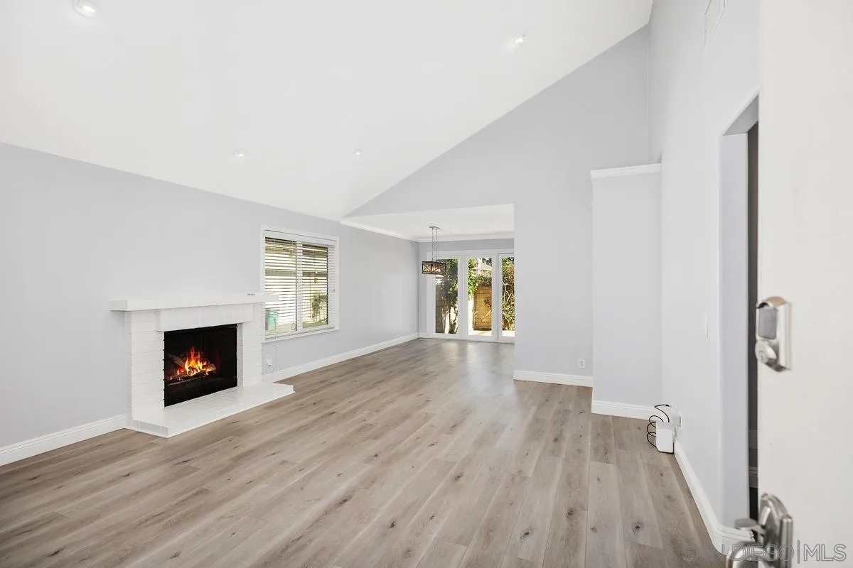 14 Dragonfly, Unit 25 Irvine, CA 92604 - Photo 1 of 29 a view of an empty room with a fireplace and a window