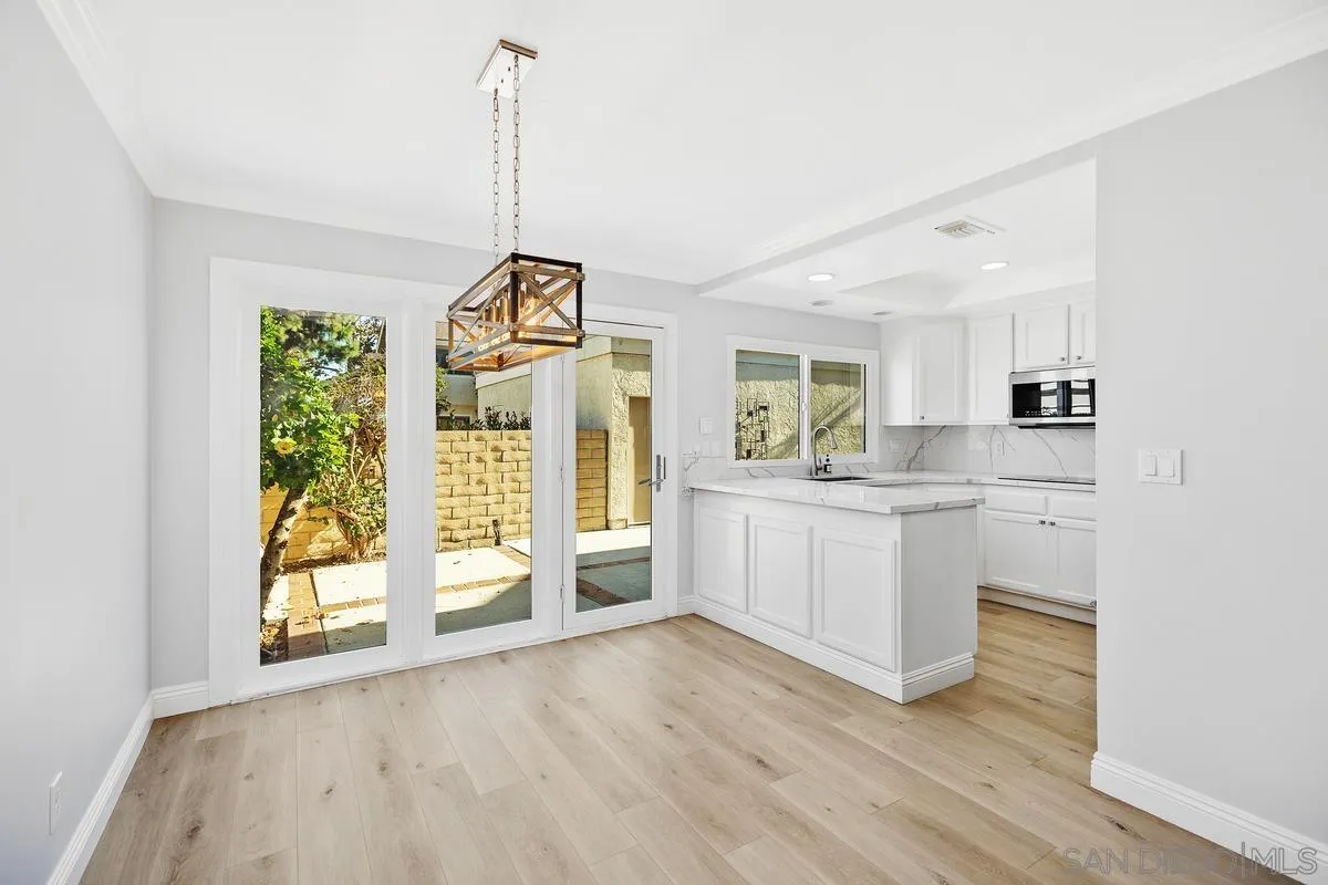 14 Dragonfly, Unit 25 Irvine, CA 92604 - Photo 12 of 32 a view of a kitchen with wooden floor and a kitchen