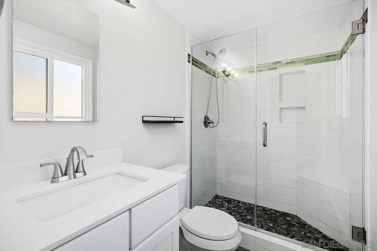 14 Dragonfly, Unit 25 Irvine, CA 92604 - Photo 22 of 29 a bathroom with a sink toilet a mirror and shower