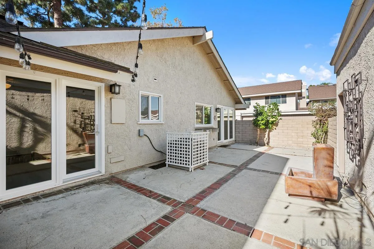 14 Dragonfly, Unit 25 Irvine, CA 92604 - Photo 24 of 29 a view of a patio with a table and chairs