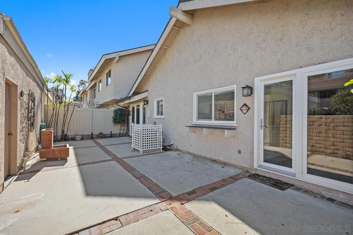 14 Dragonfly, Unit 25 Irvine, CA 92604 - Photo 29 of 32 a view of a house with a large windows and plants