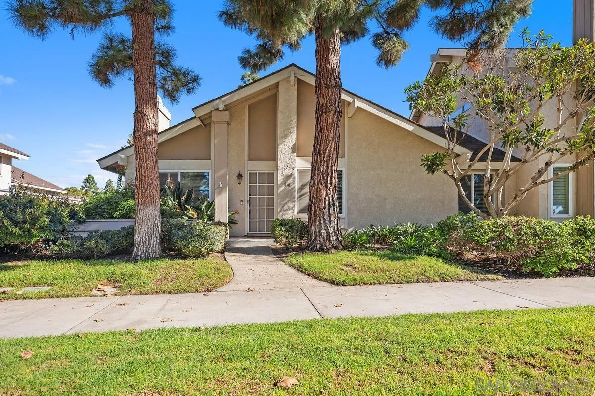 14 Dragonfly, Unit 25 Irvine, CA 92604 - Photo 3 of 32 a front view of a house with garden