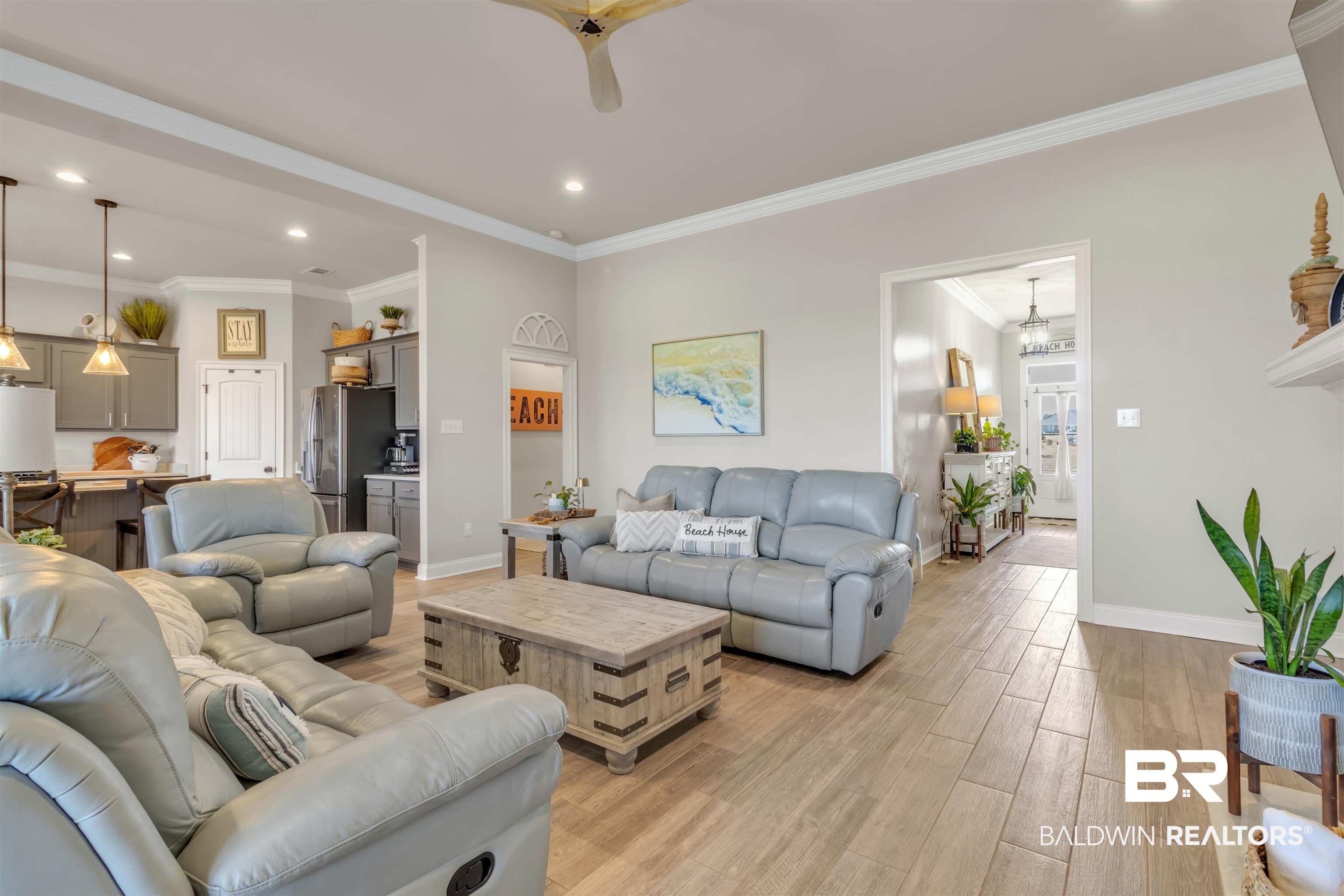 22531 Putter Lane Foley, AL 36535 - Photo 16 of 43 Living room featuring light wood-style flooring, ornamental molding, and recessed lighting
