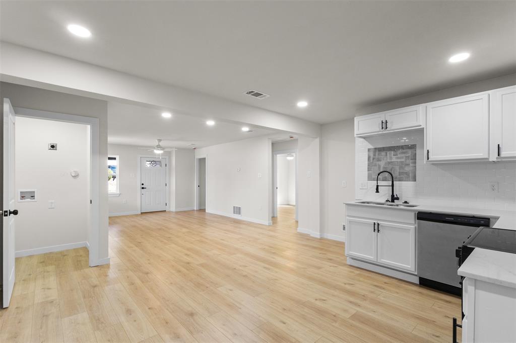 3811 Malden Lane Dallas, TX 75216 - Photo 12 of 33 a kitchen with granite countertop a sink and cabinets