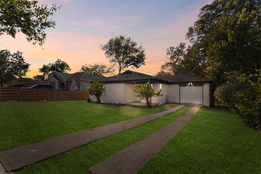 3811 Malden Lane Dallas, TX 75216 - Photo 4 of 33 a front view of a house with a garden and yard