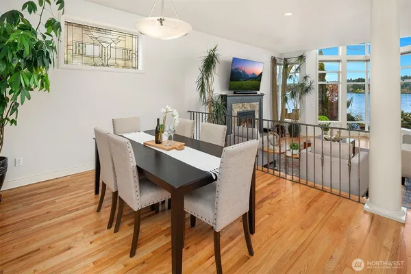 a view of a dining room with furniture and wooden floor