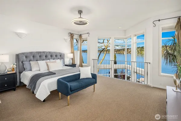 a bedroom with a large bed and a couch