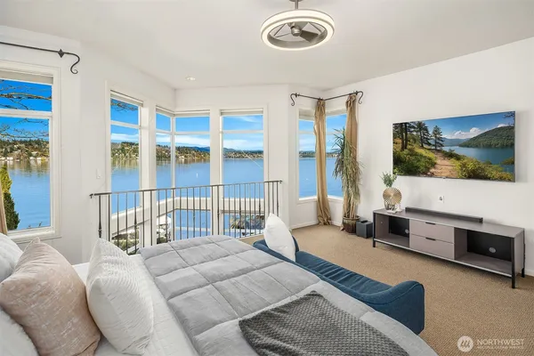 a living room with furniture tv and a flat screen tv
