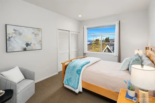 a bedroom with a bed and a couch