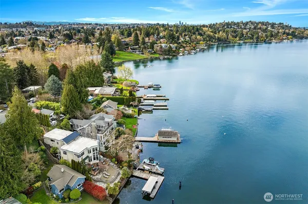 an aerial view of a house with a lake view