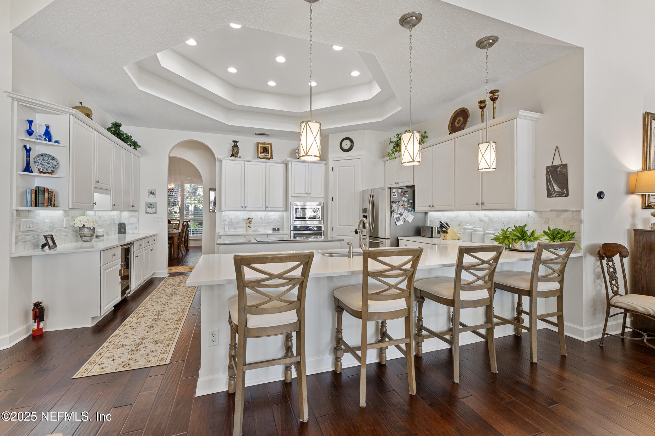 686 Frederic Drive Fleming Island, FL 32003 - Photo 11 of 57 a large kitchen with a table and chairs